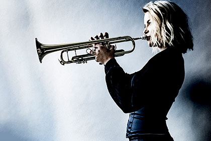 Bria Skonberg pictured playing trumpet