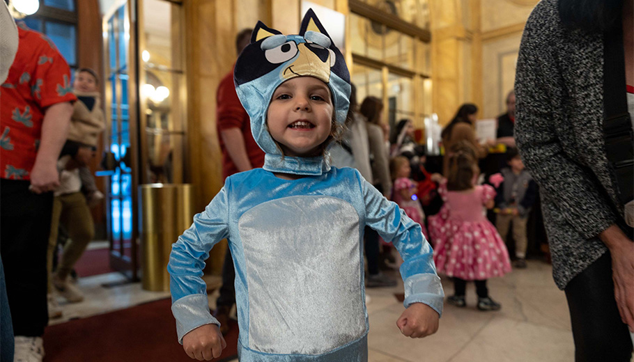 A child in a Bluey costume.