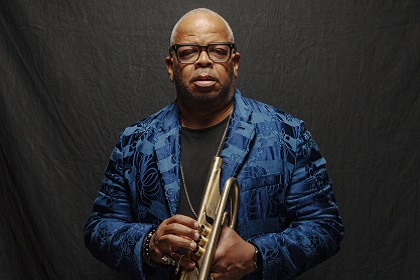 Headshot of musician Terence Blanchard holding a trumpet.