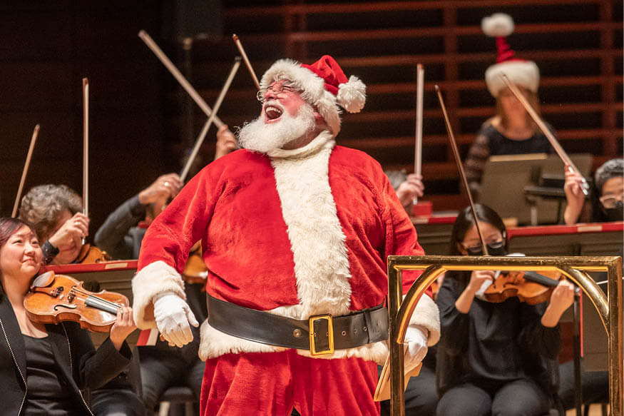 Children’s Holiday Spectacular key image of Santa conducting the orchestra.