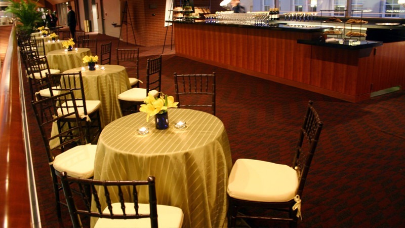 Beautiful tables line the hall of the First Tier Lounge as staff wait for guests to arrive.