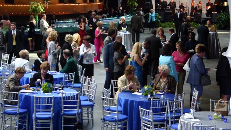 Guests enjoy a meal while networking and listening to live music at the Commonwealth Plaza.