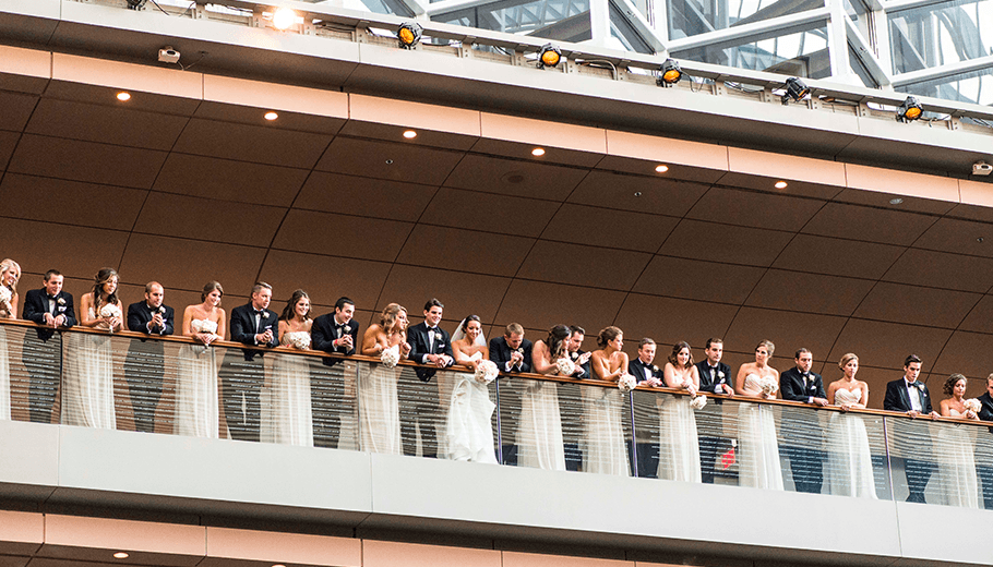 Wedding Party looks over the tier inside the Kimmel Center