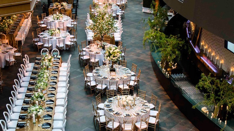Rows of chairs and tables are set and waiting for wedding guests to arrive.